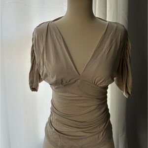 Silence + Noise small cream v-neck blouse, with ruching in waist and sleeves.